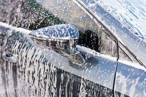 Self-service car wash with foamy bubbles